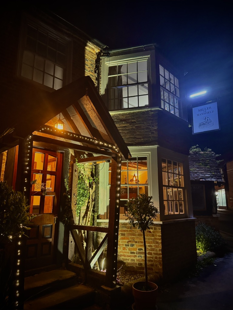 The Miller entrance lit up on a winter evening